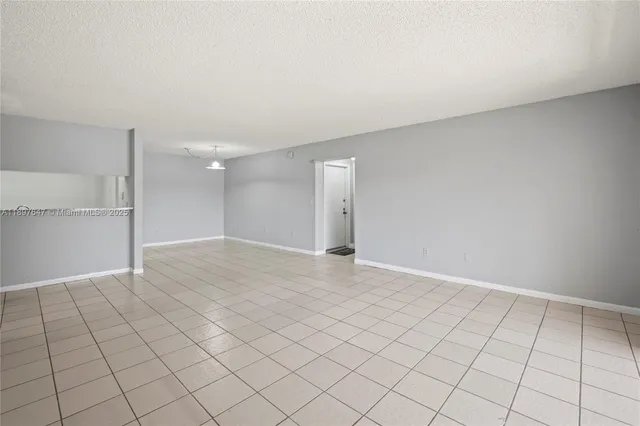 a kitchen with a sink appliances and cabinets