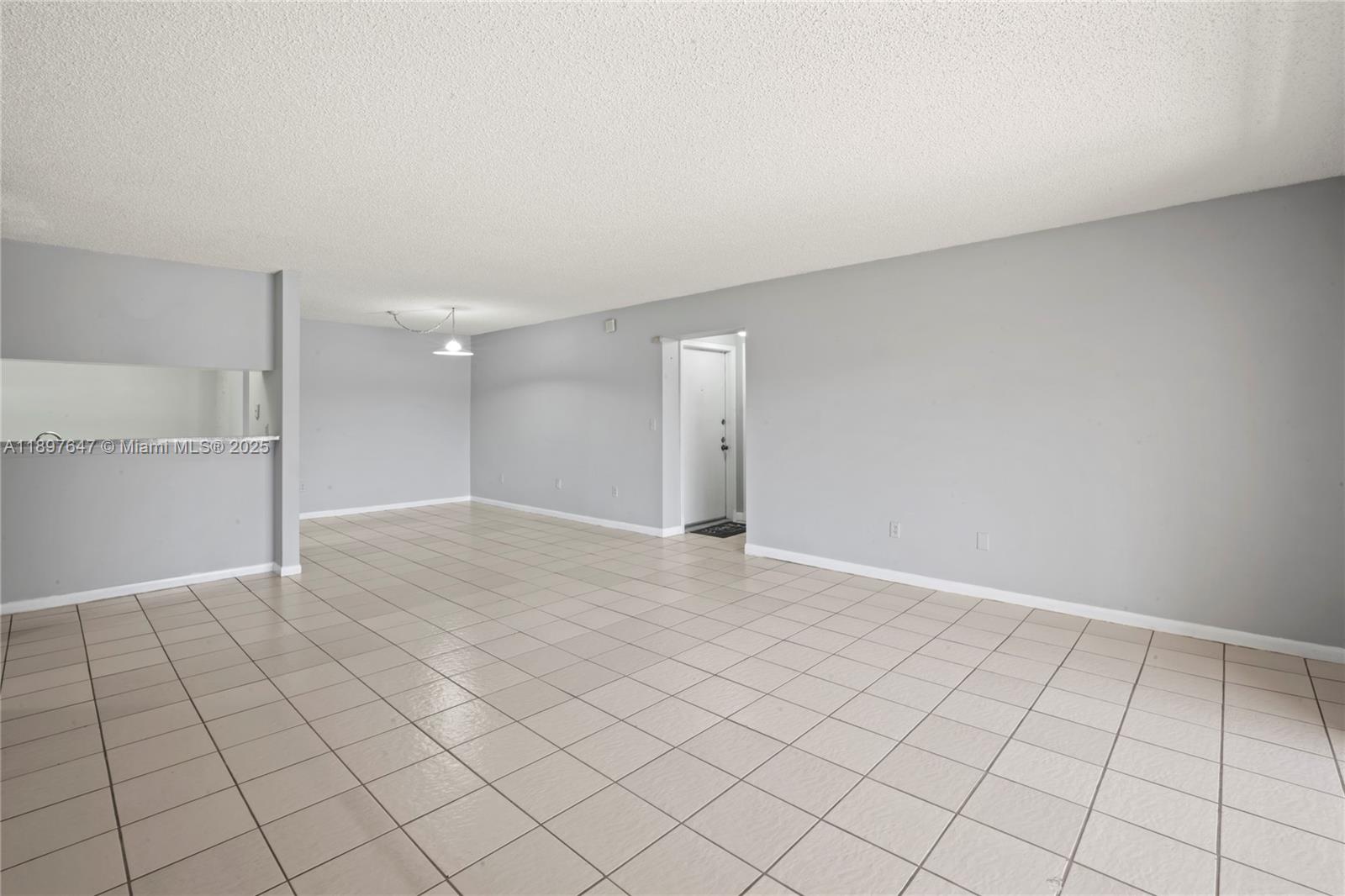 8530 Southwest 149th Avenue, Unit 906 Miami, FL 33193 - Photo 7 of 20 a view of an empty room and window