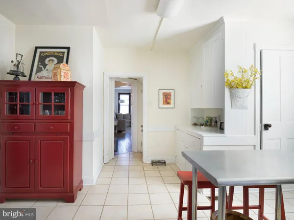a kitchen with stainless steel appliances granite countertop a sink and a refrigerator