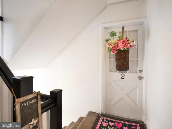 a kitchen with a sink window and cabinets