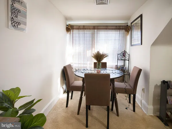 a kitchen with stainless steel appliances granite countertop wooden cabinets a stove top oven and a sink