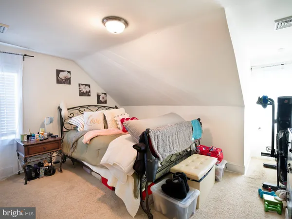 a bathroom with a sink cabinets and a window