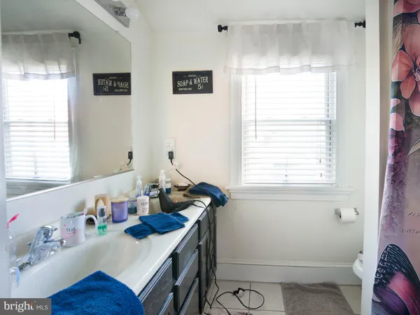 a view of a livingroom with furniture and a flat screen tv