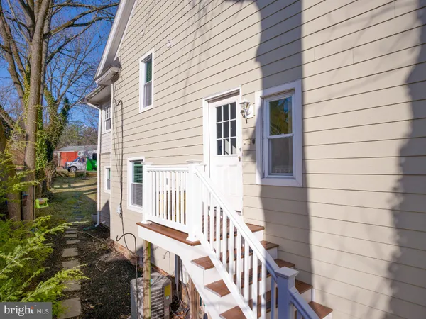 a view of a house with wooden fence