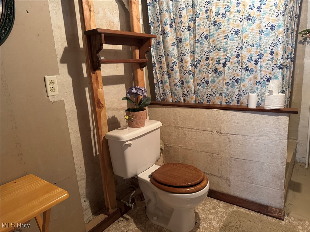 71322 Sharon Road Bridgeport, OH 43912 - Photo 33 of 39 half bath-shower- commodode in basement