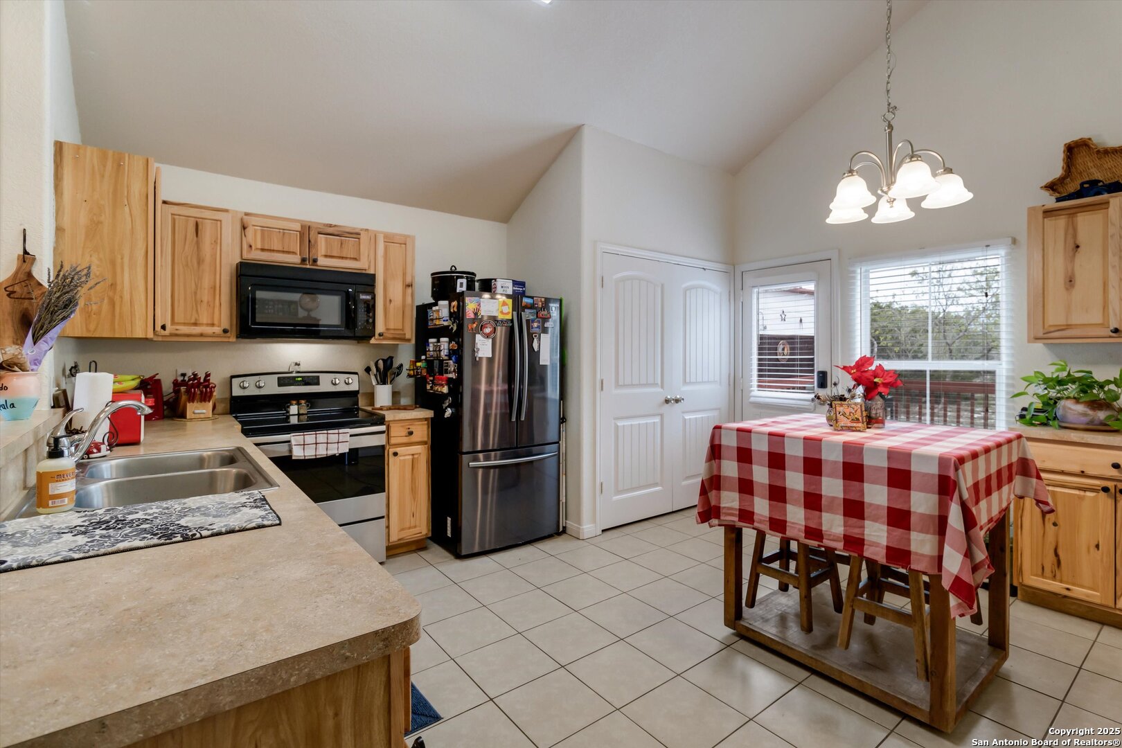 6016 Apache Moon Spring Branch, TX 78070 - Photo 12 of 32 a kitchen with stainless steel appliances kitchen island granite countertop a refrigerator and a stove top oven