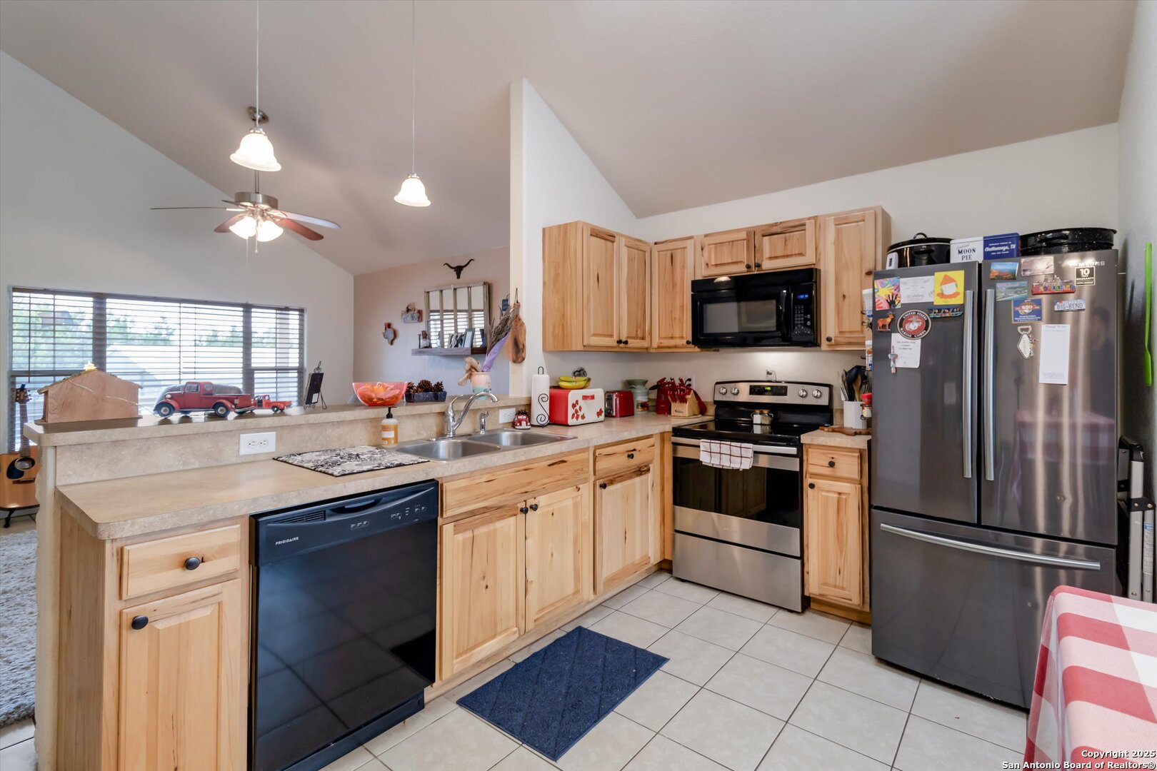6016 Apache Moon Spring Branch, TX 78070 - Photo 14 of 32 a kitchen with a sink stainless steel appliances and cabinets