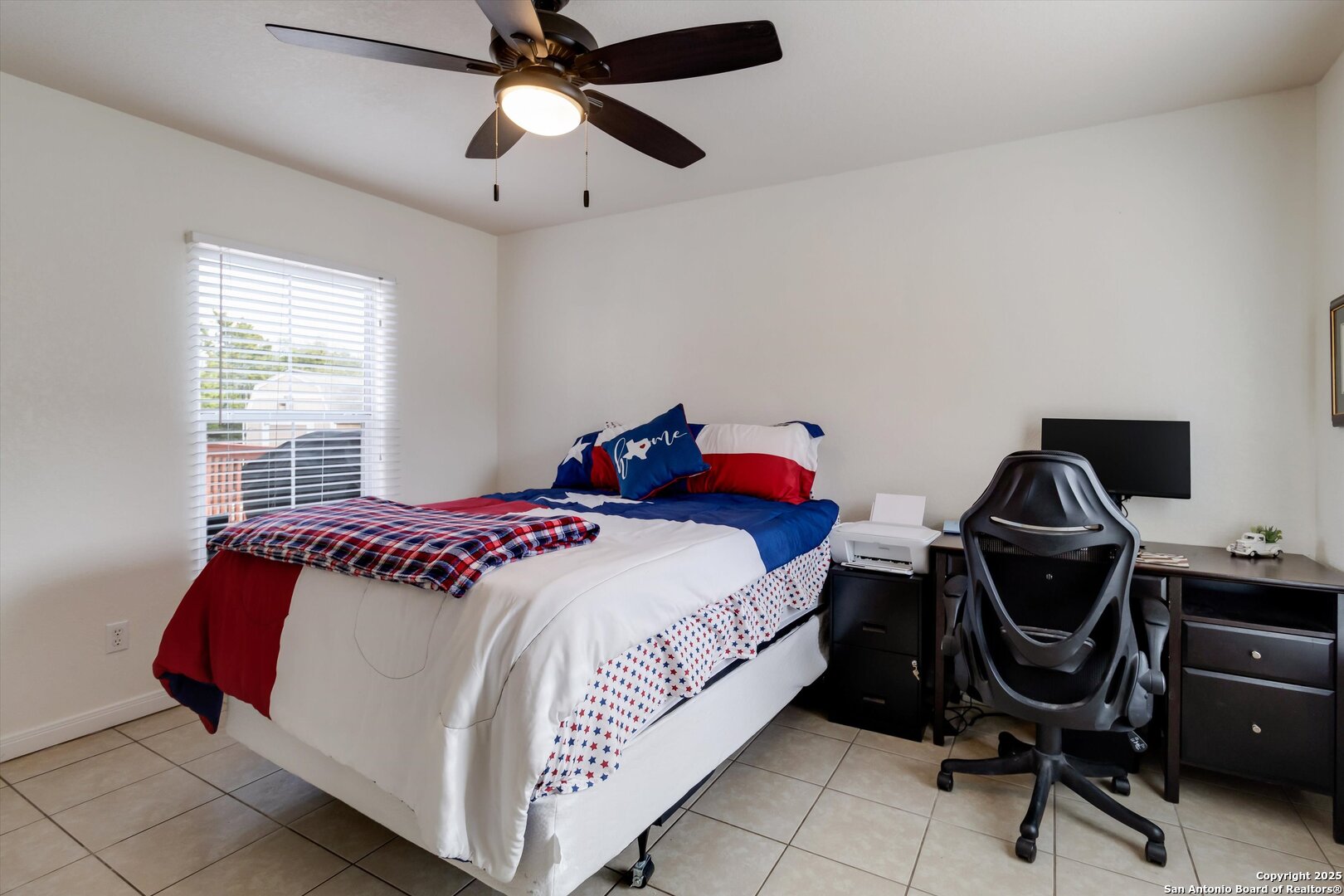 6016 Apache Moon Spring Branch, TX 78070 - Photo 16 of 32 a bedroom with a bed and a chandelier