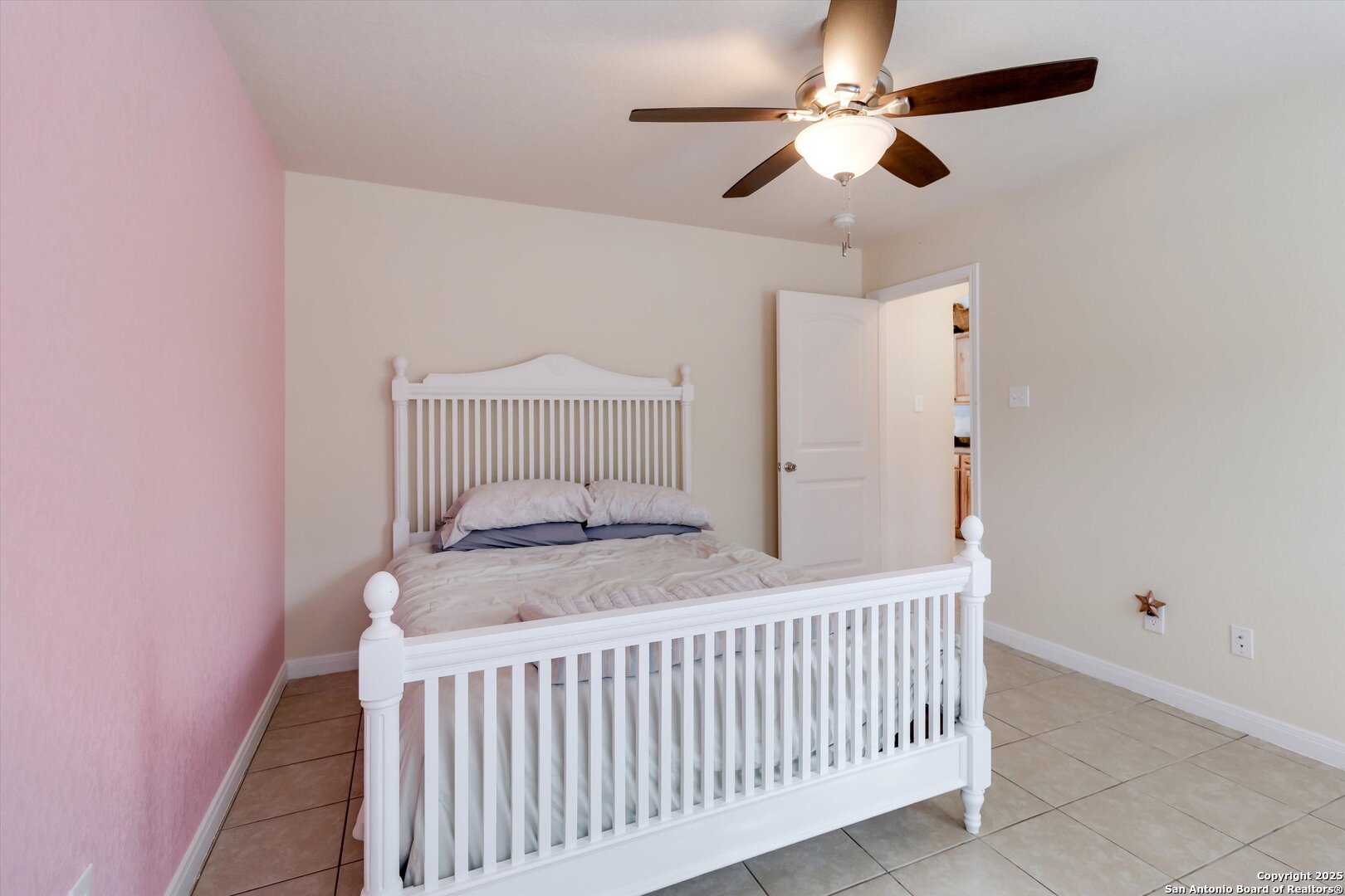 6016 Apache Moon Spring Branch, TX 78070 - Photo 18 of 32 a bedroom with a bed and a chandelier