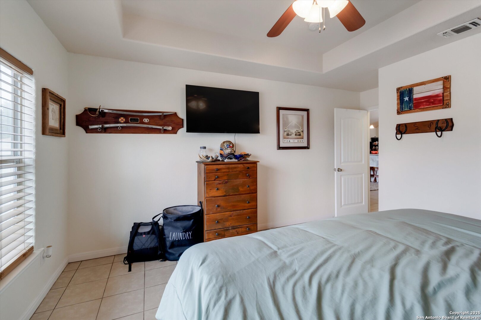 6016 Apache Moon Spring Branch, TX 78070 - Photo 20 of 32 a bedroom with bed and tv
