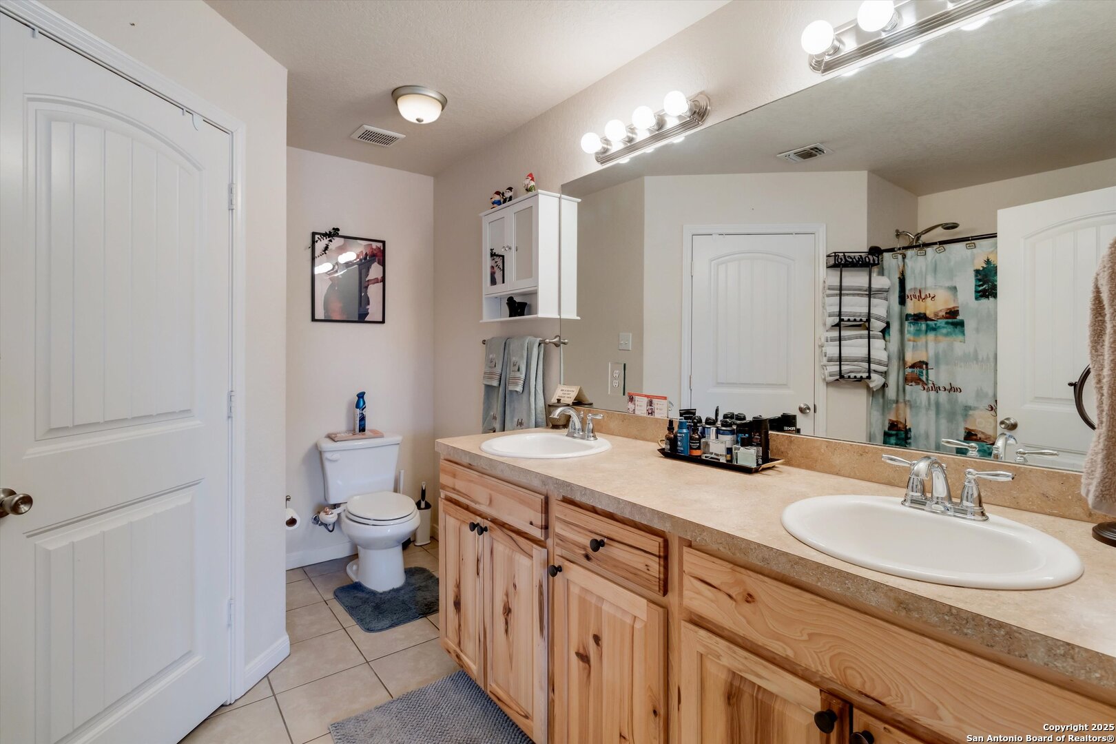 6016 Apache Moon Spring Branch, TX 78070 - Photo 21 of 32 a bathroom with a sink double vanity and a toilet