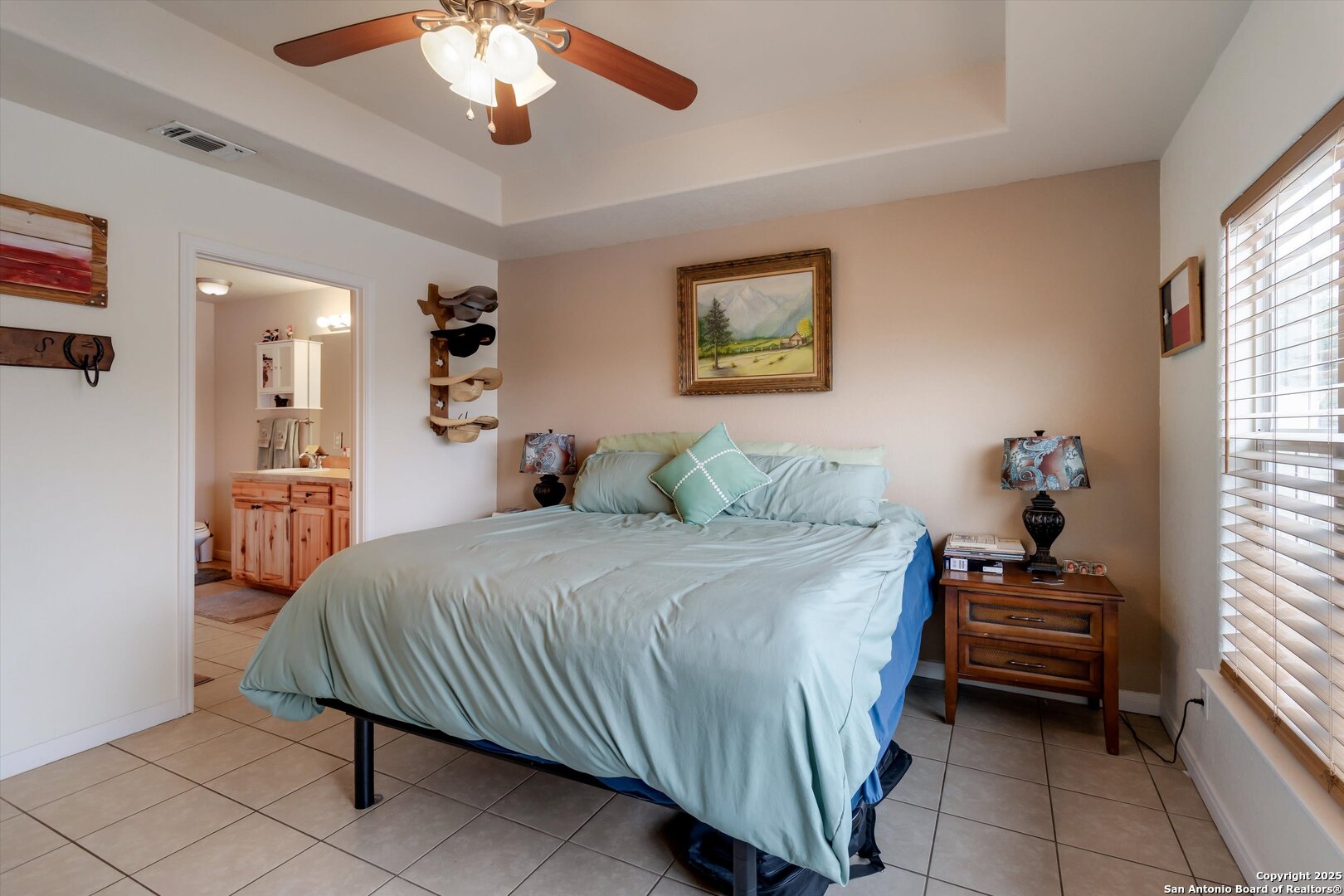 6016 Apache Moon Spring Branch, TX 78070 - Photo 23 of 32 a bedroom with a bed and a chandelier