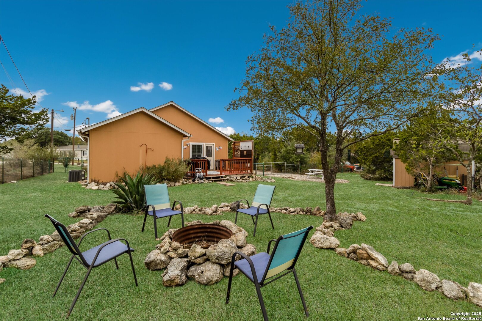 6016 Apache Moon Spring Branch, TX 78070 - Photo 28 of 32 a view of a house with backyard sitting area and garden