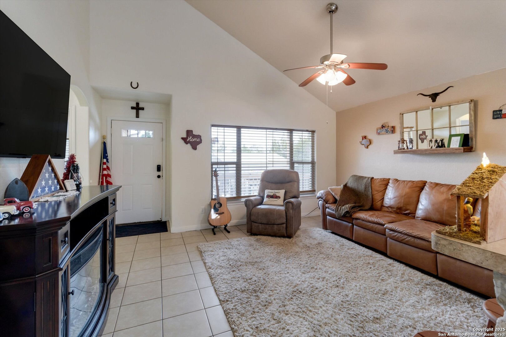 6016 Apache Moon Spring Branch, TX 78070 - Photo 8 of 32 a living room with furniture a flat screen tv and a window