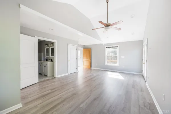 a bathroom with a shower a toilet and a sink