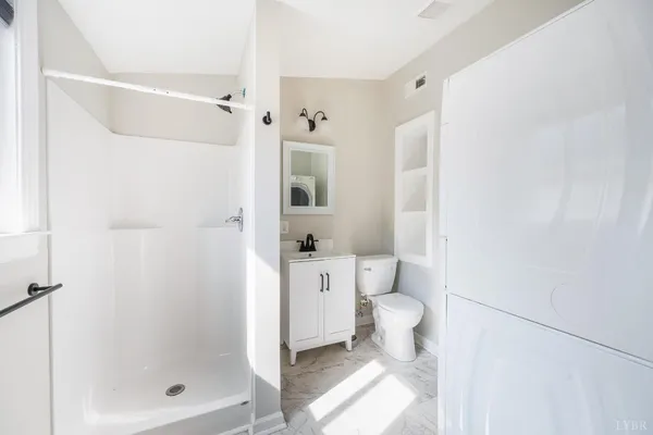 a stove top oven sitting inside of a kitchen