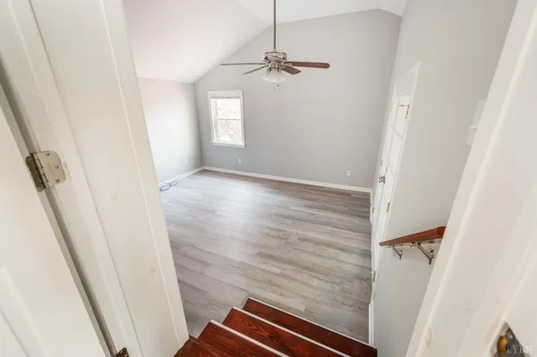 an aerial view of a house with a garden and plants