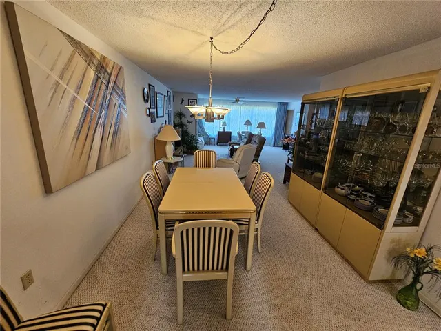 a outdoor living space with furniture and a fireplace