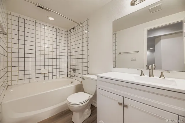 a bathroom with a toilet a sink and a bathtub