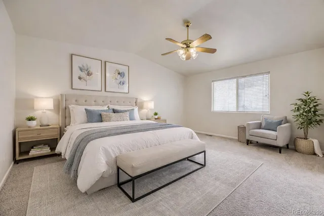 a bedroom with a bed and couch