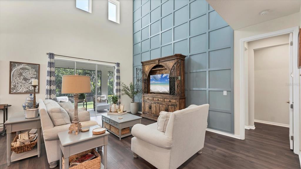 5935 Maidenstone Way Palmetto, FL 34221 - Photo 13 of 52 a living room with furniture and a flat screen tv
