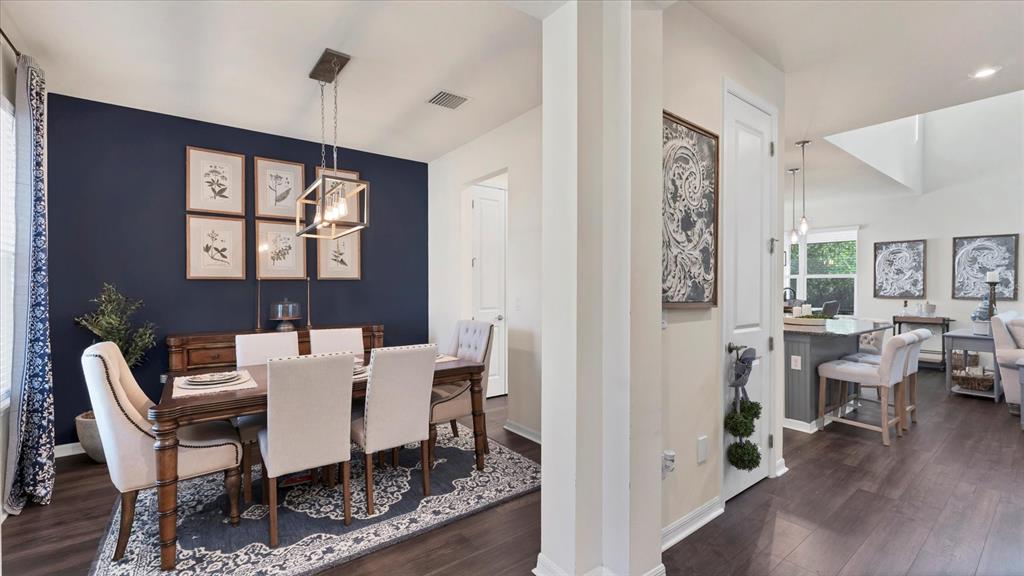 5935 Maidenstone Way Palmetto, FL 34221 - Photo 15 of 52 a view of a dining room with furniture window and wooden floor