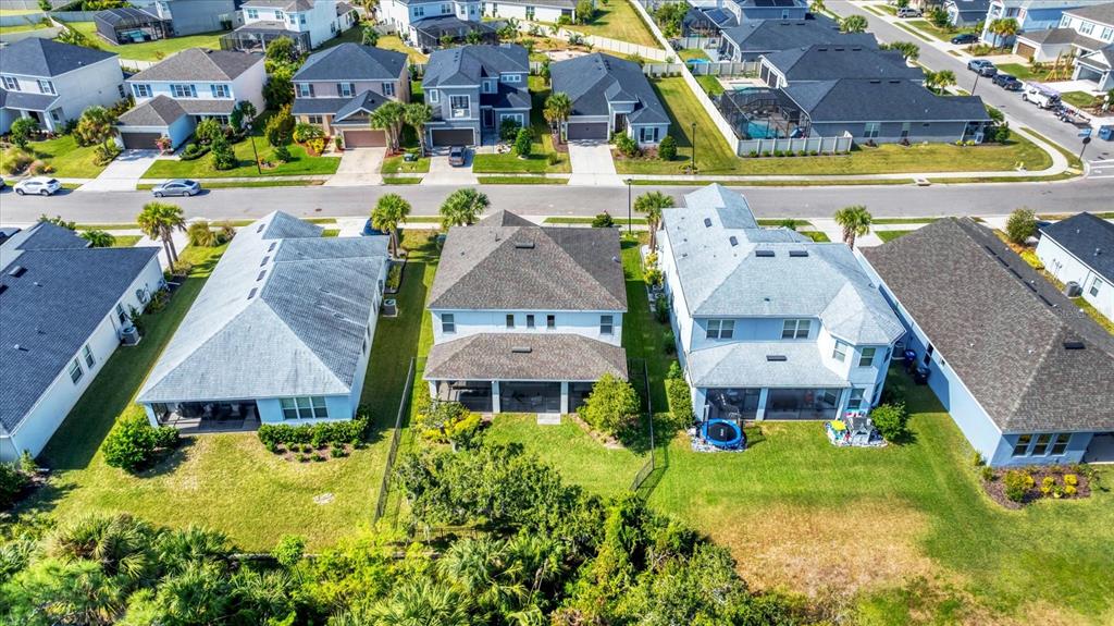 5935 Maidenstone Way Palmetto, FL 34221 - Photo 2 of 52 an aerial view of multiple houses with yard