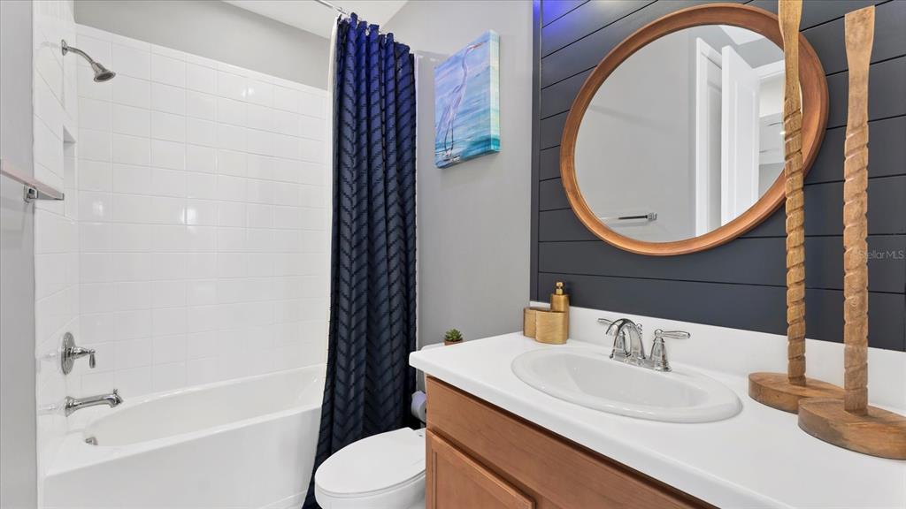 5935 Maidenstone Way Palmetto, FL 34221 - Photo 25 of 52 a bathroom with a sink and a mirror