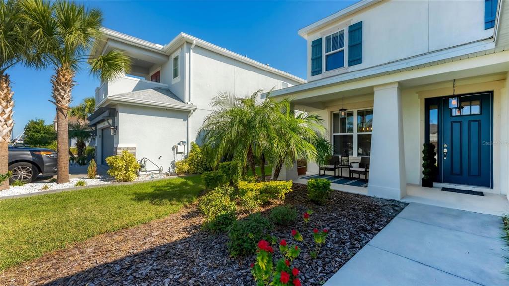 5935 Maidenstone Way Palmetto, FL 34221 - Photo 3 of 52 a view of a house with a yard and plants