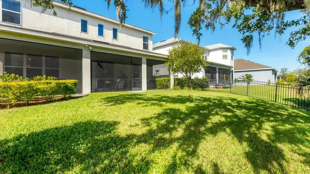 a view of a house with a yard and plants