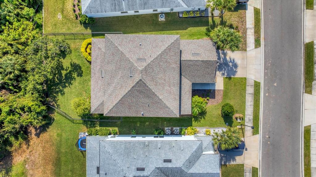 5935 Maidenstone Way Palmetto, FL 34221 - Photo 34 of 52 an aerial view of a house with a garden and swimming pool