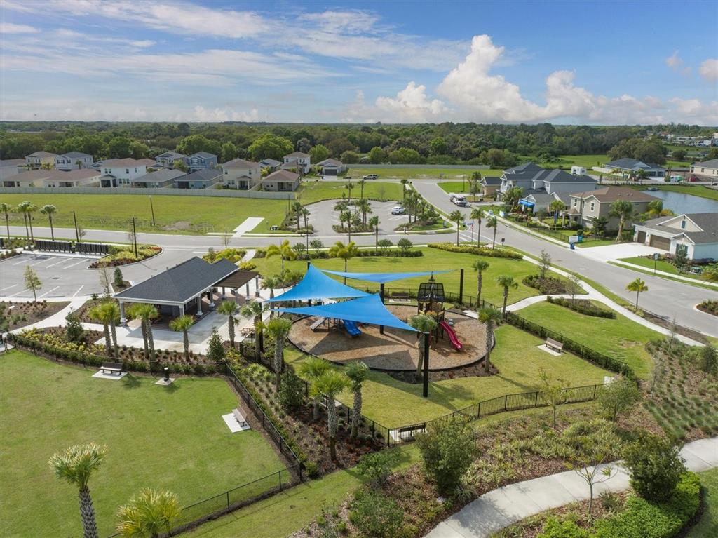 5935 Maidenstone Way Palmetto, FL 34221 - Photo 44 of 52 a view of a lake with a city