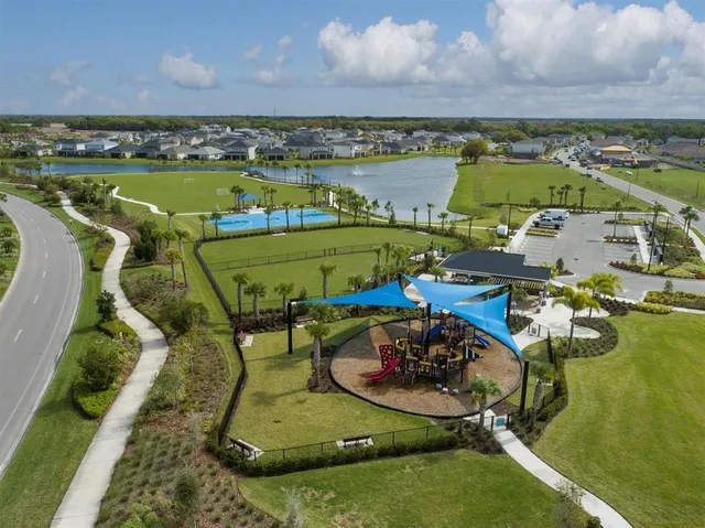 an aerial view of residential houses with outdoor space