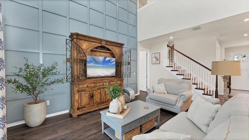 5935 Maidenstone Way Palmetto, FL 34221 - Photo 50 of 52 a living room with furniture and wooden floor