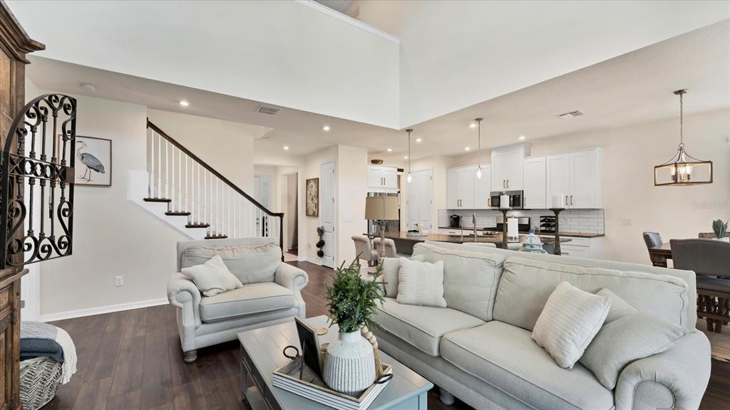 5935 Maidenstone Way Palmetto, FL 34221 - Photo 51 of 52 a living room with furniture white walls and wooden floor