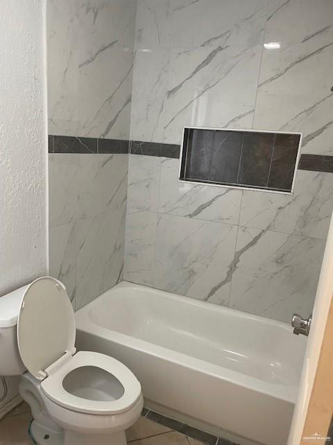 2432 West Iris Avenue McAllen, TX 78501 - Photo 15 of 16 a white toilet sitting next to a bath tub