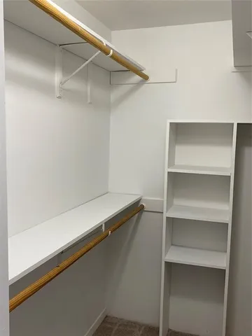 a view of an empty walk in closet