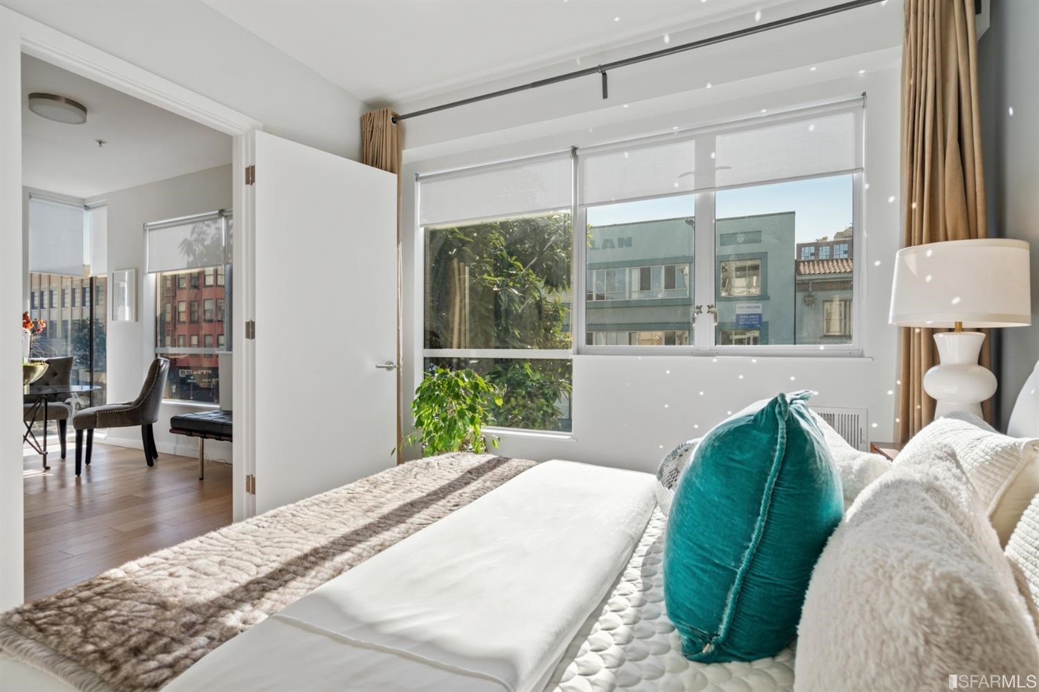 788 Minna, Unit 202 San Francisco, CA 94103 - Photo 6 of 11 a bedroom with furniture and a large window
