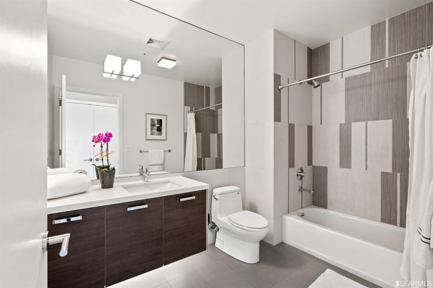 788 Minna, Unit 202 San Francisco, CA 94103 - Photo 7 of 11 a bathroom with a sink a toilet and shower