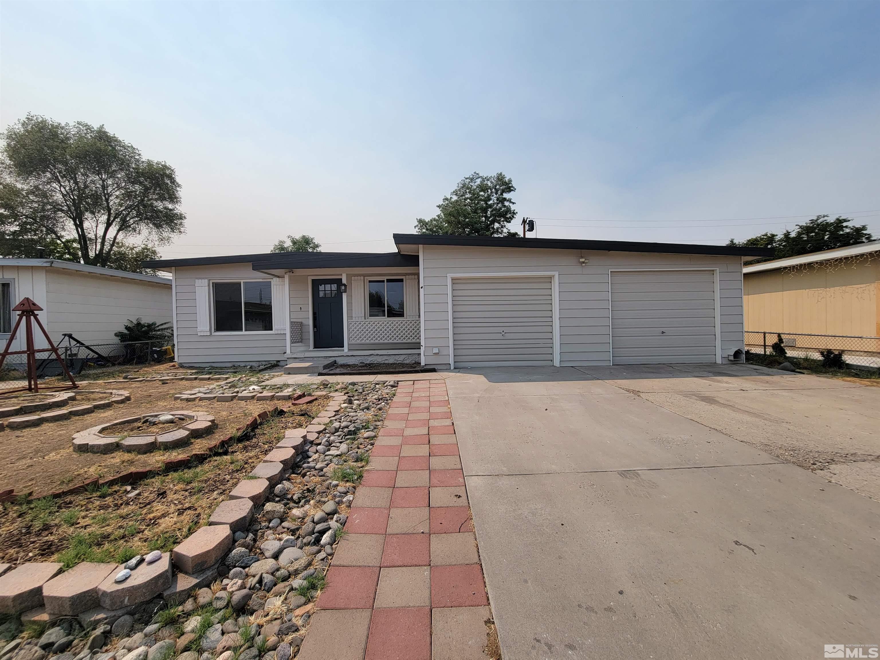 1801 Radcliffe Drive Reno, NV 89502 - Photo 1 of 18 a front view of a house with a yard