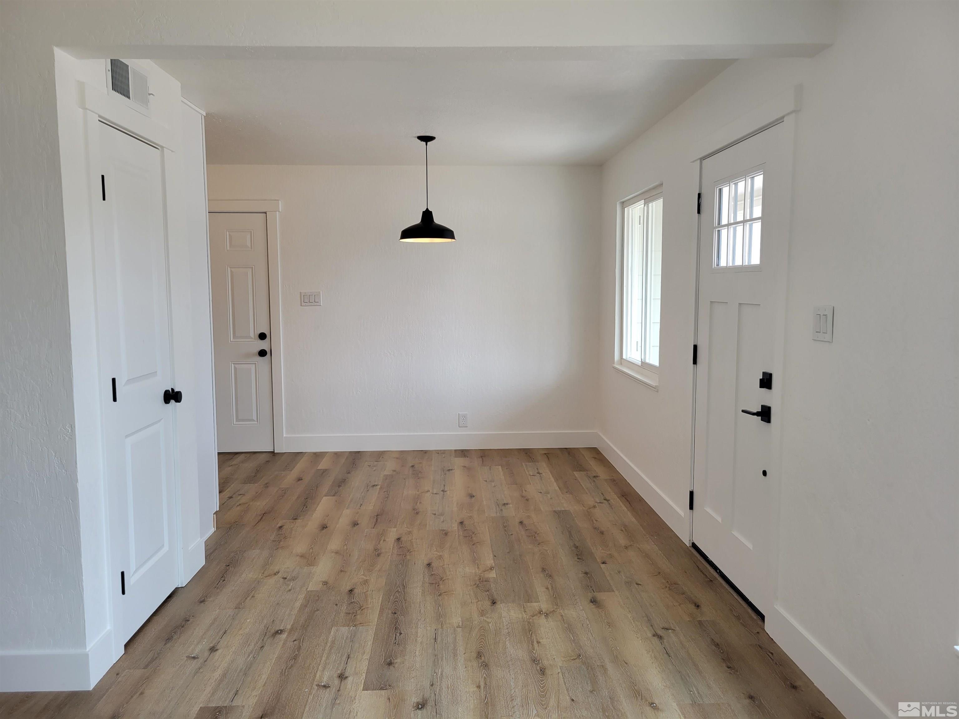 1801 Radcliffe Drive Reno, NV 89502 - Photo 4 of 18 wooden floor with window in an empty room