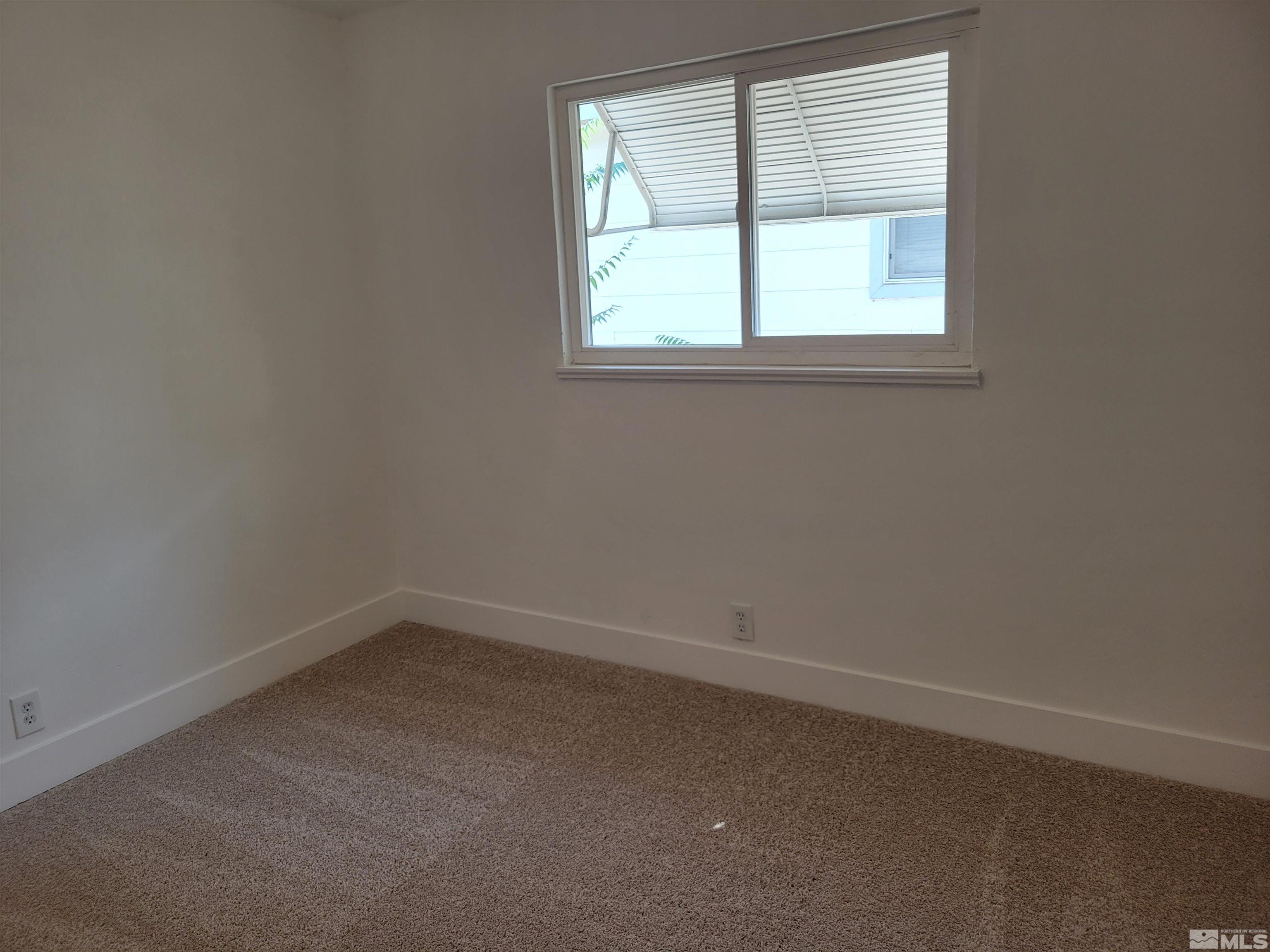 1801 Radcliffe Drive Reno, NV 89502 - Photo 8 of 18 an empty room with a window
