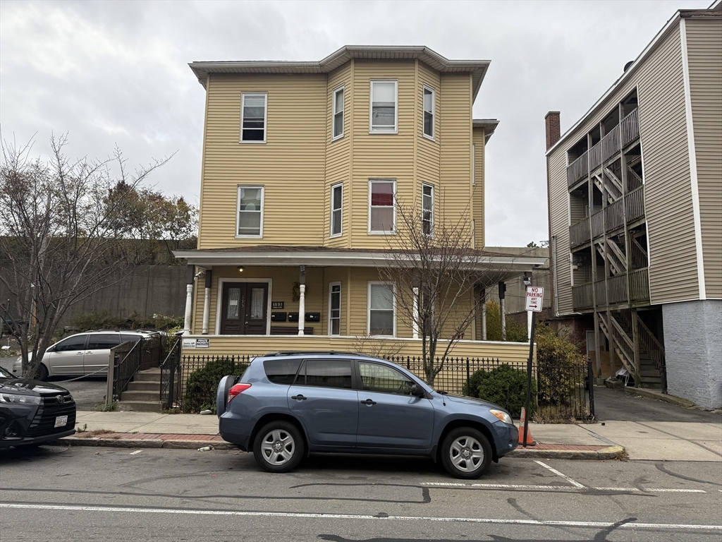 a car parked in front of a house
