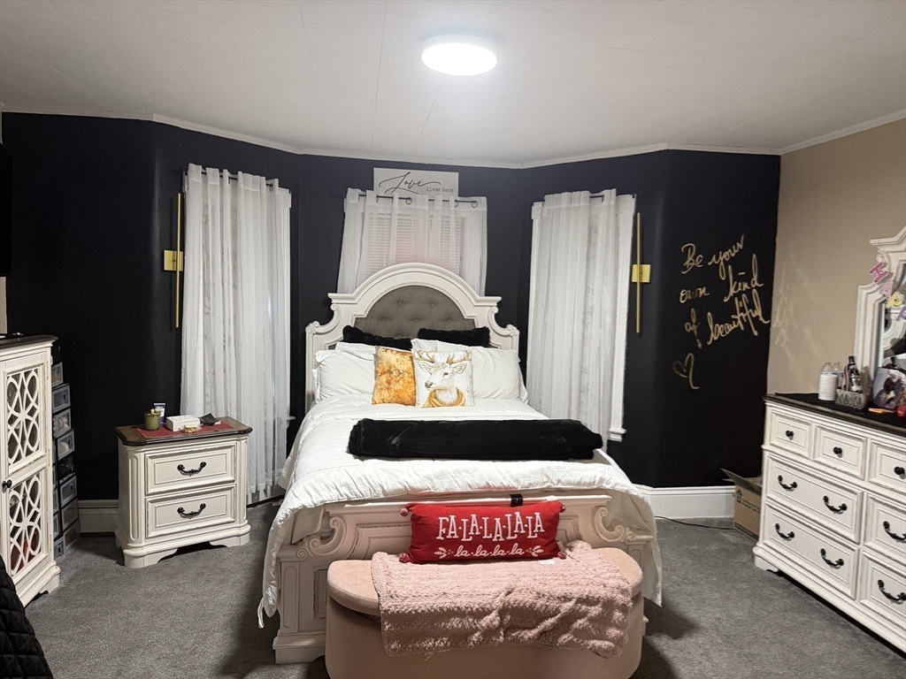 195 Millbury Street Worcester, MA 01610 - Photo 18 of 25 a bedroom with a bed and dresser