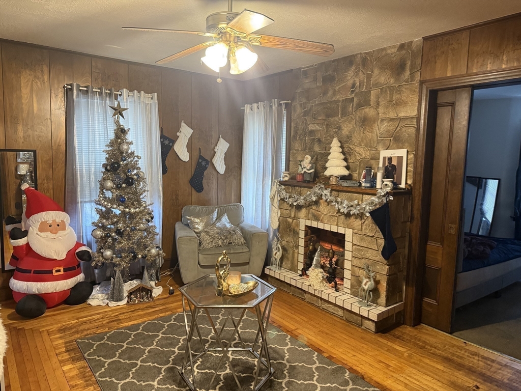 195 Millbury Street Worcester, MA 01610 - Photo 20 of 25 a living room with furniture and a fireplace