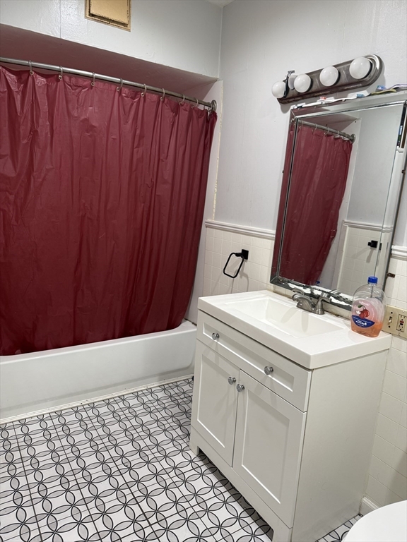 195 Millbury Street Worcester, MA 01610 - Photo 4 of 25 a bathroom with a sink and a mirror