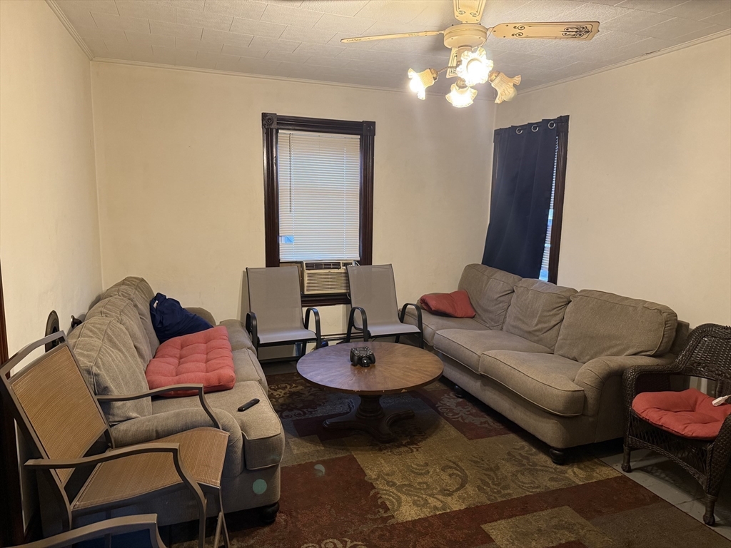195 Millbury Street Worcester, MA 01610 - Photo 5 of 25 a living room with furniture and a mirror