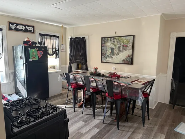 a view of a dining room with furniture and window