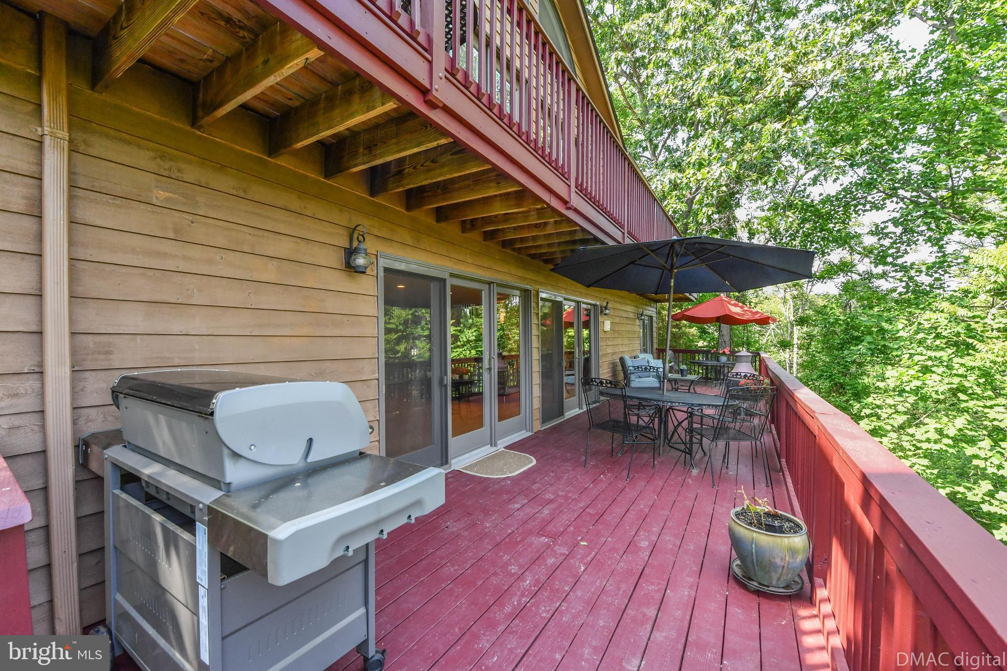 6951 Meadowlake Road New Market, MD 21774 - Photo 20 of 54 Main level deck full length of the house