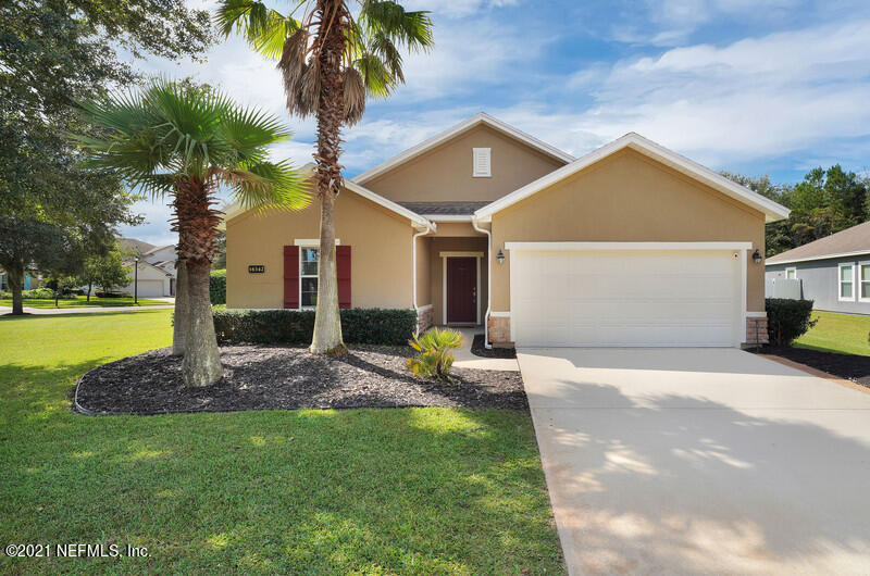16342 Tisons Bluff Road Jacksonville, FL 32218 - Photo 1 of 57 a front view of a house with garden